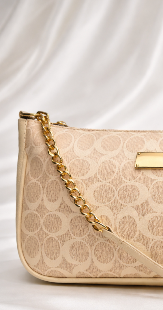Compact beige printed bag showing gold and stylish finish for women in pakistan