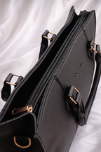 Professional black handbag for girls in Pakistan featuring durable straps and minimalist design for formal wear - Silslah Store