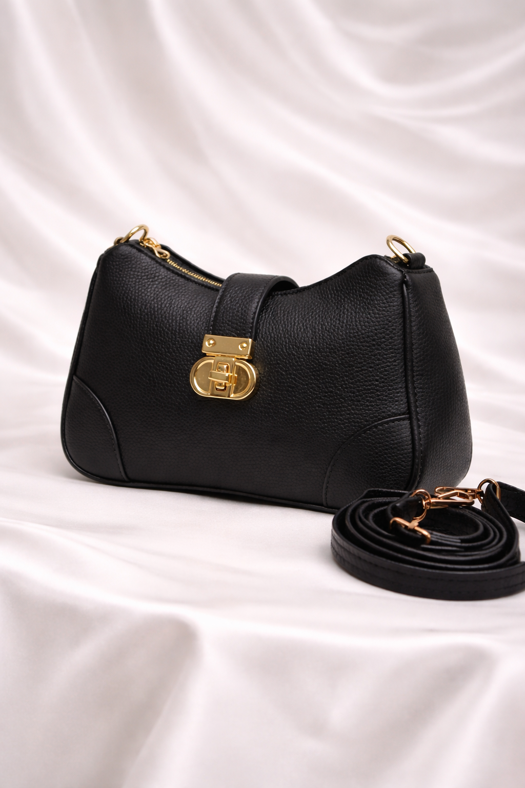 Black pebbled leather crossbody bag with adjustable strap for university in Pakistan