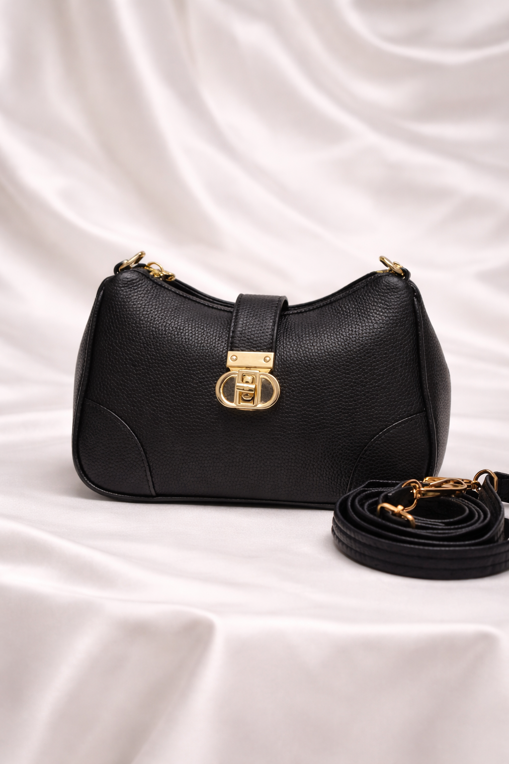 Black pebbled leather crossbody bag with adjustable strap for daily use in Pakistan