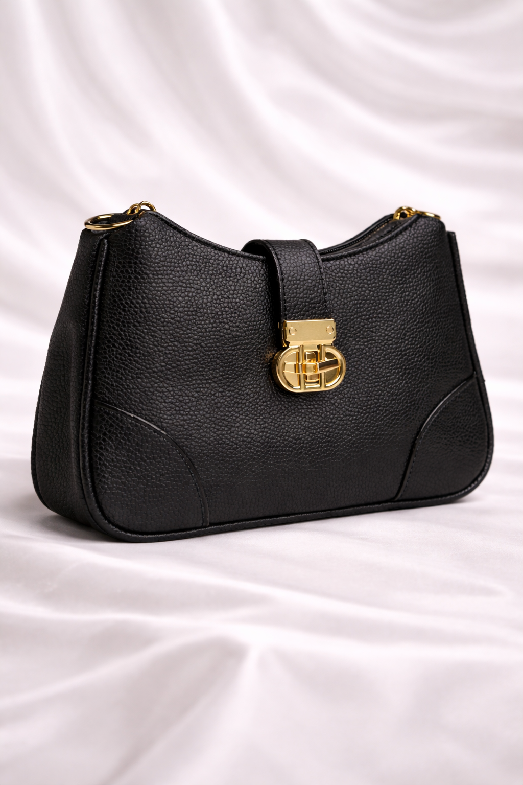 Black pebbled leather crossbody bag with adjustable strap for dinners, outings in Pakistan