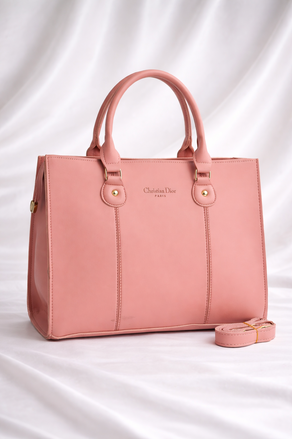 Chic blush pink structured tote bag perfect for carrying laptops and office essentials
