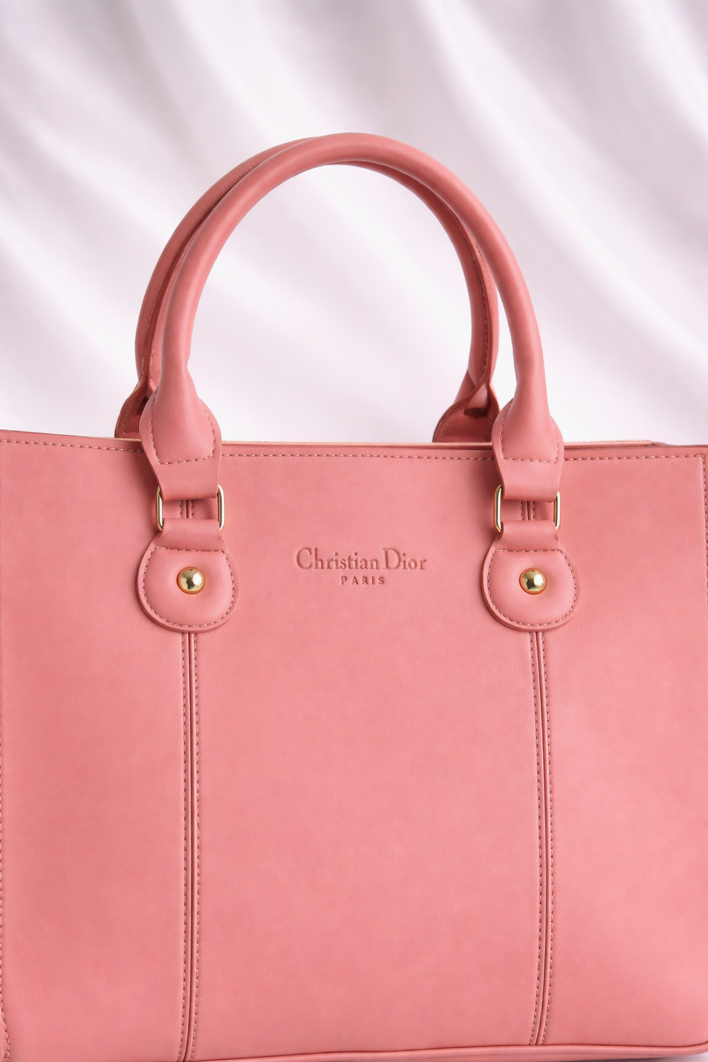 Elegant and spacious pink shoulder bag for working women with a professional structured look best for office and daily use