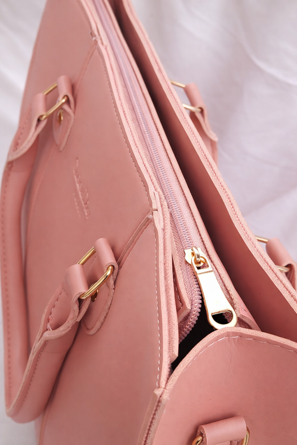 Elegant and spacious pink shoulder bag for women with a professional structured look best for university and college students