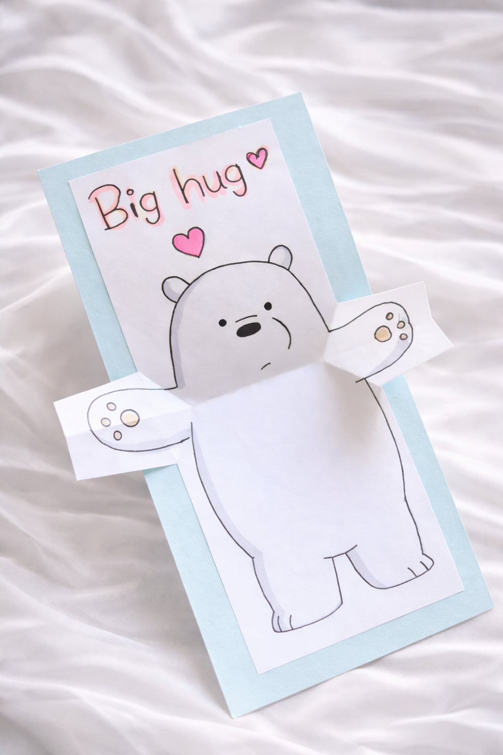 Card with a cartoon bear holding a heart and text 'Big hug' for the long distance hug