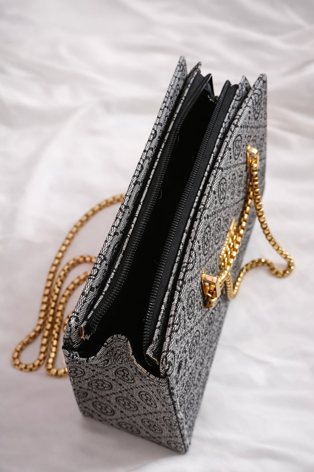 Spacious grey formal handbag with protective feet and premium lining for office use