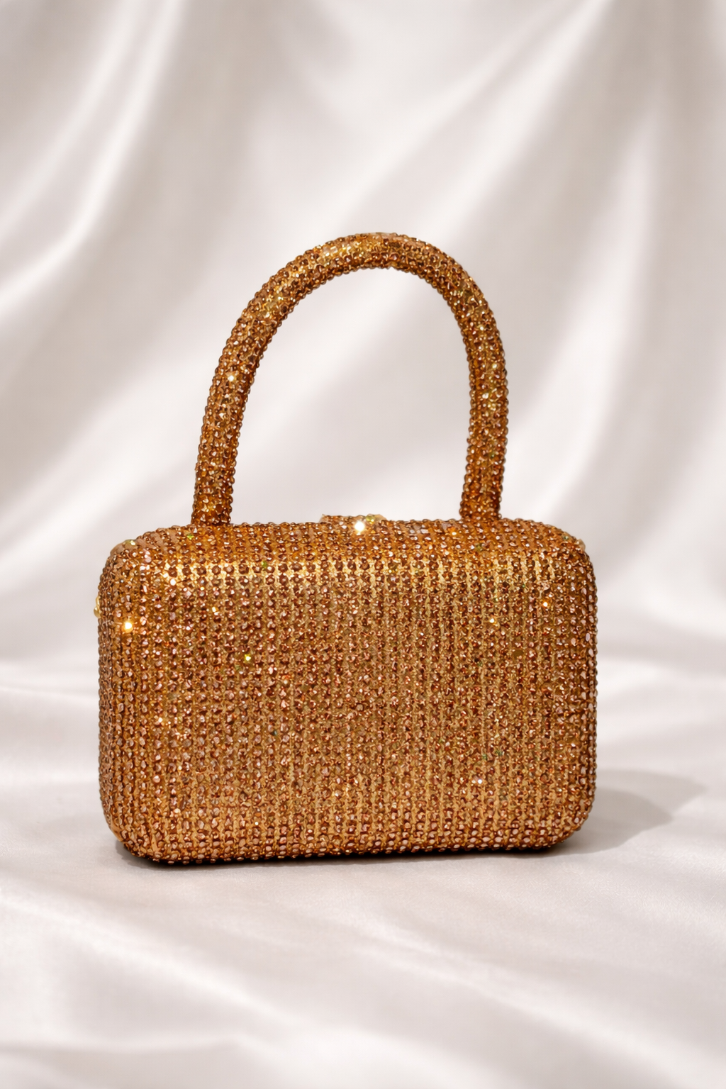 Gold beaded handbag on a white background