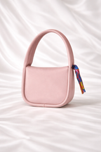 Close up of silk scarf handle and gold hardware on Silslah mini luxury handbag