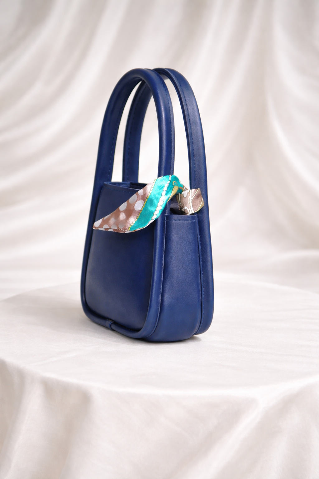 Kids designer handbag for girls with gold clasp and decorative floral scarf accessory