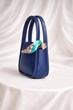Kids designer handbag for girls with gold clasp and decorative floral scarf accessory