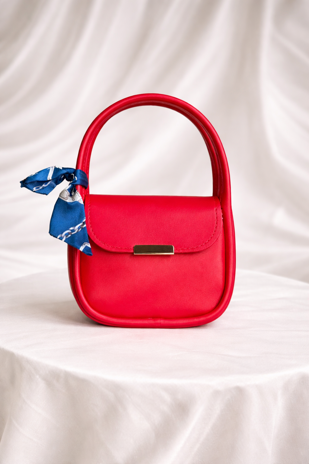 Affordable Designer handbag for baby girls with gold detailing and floral scarf 