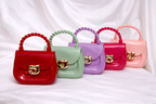 Luxury and affordable mini silicon handbag for little girls with stylish twisted top handle
