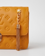 Mustard Embossed Bag for Women with Gold Detailing and Chain Strap