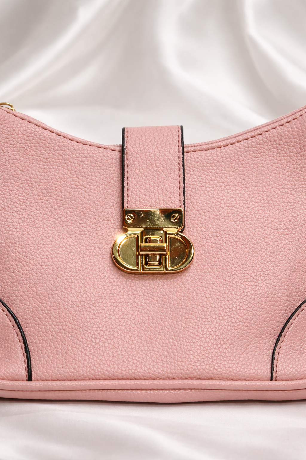 Soft pink pebbled leather finish with luxury gold detailing and durable stitching for long lasting use