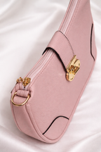 Side view of pink leather sling bag showing slim and stylish design for girls