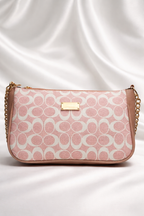 Elegant pink printed handbag with  gold detailing and chain strap best for party wear