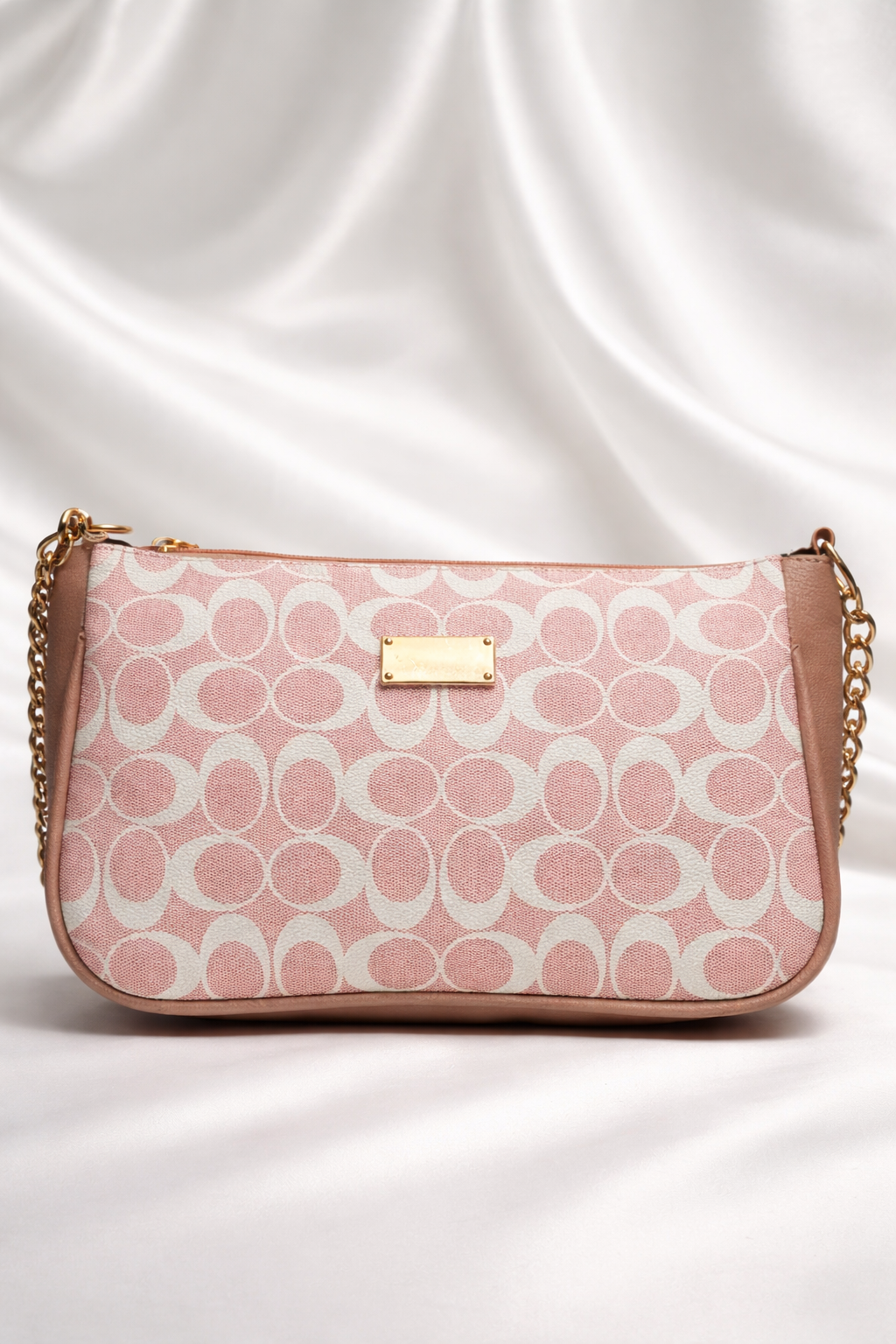 Elegant pink printed handbag with  gold detailing and chain strap best for party wear