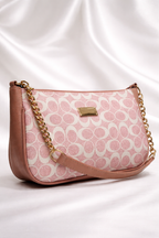 Elegant pink printed handbag with decorative gold chain strap for party wear