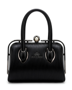 Close-up of rhinestone frame and pearl connector handles on Silslah black handbag