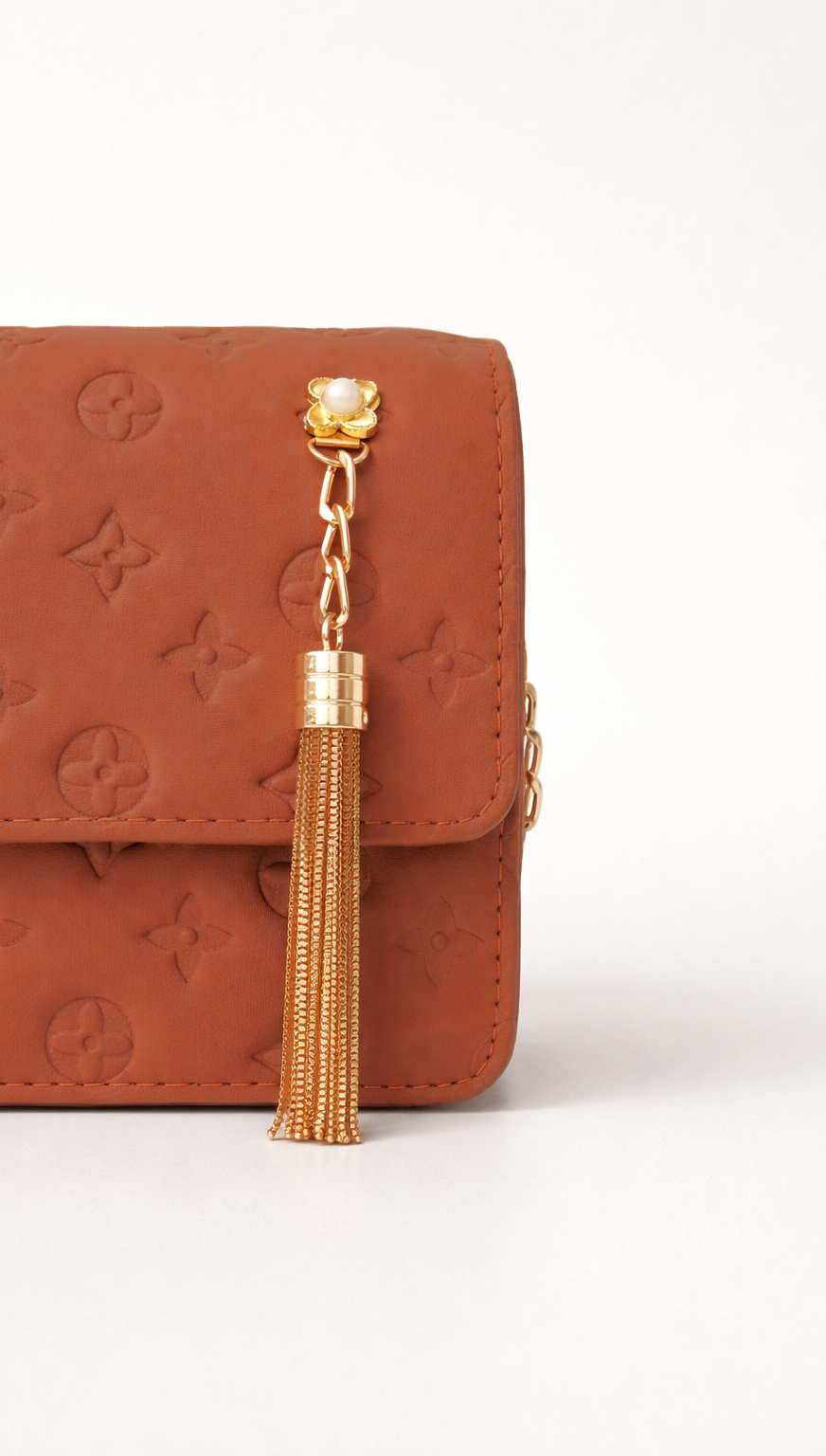 Elegant tan brown embossed handbag in Pakistan featuring durable strap, gold detailing, and practical storage for everyday essentials - Silslah Store